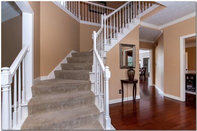 Foyer Features a Turned Staircase