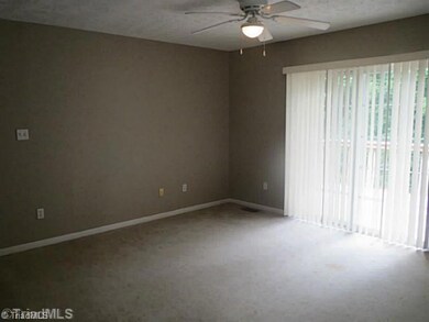 Den/Family/Great Room. The family room is the heart of this home and features sliding glass doors providing access to the deck and wooded back yard.
