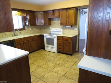 The eat-in kitchen is spacious and comes with a ra