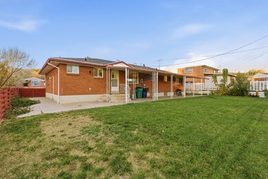 Back of house featuring a patio area, brick siding, and entry steps