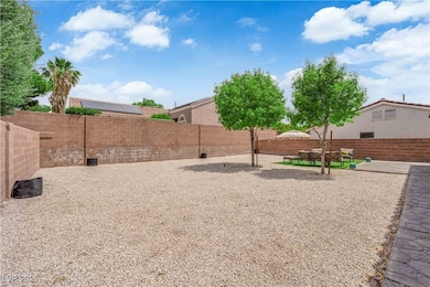 Back of house featuring a fenced backyard, stucco