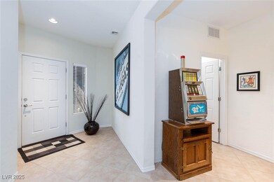 Foyer featuring light tile patterned floors