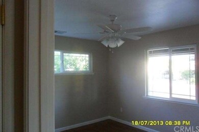 Bedroom with ceiling light and fan