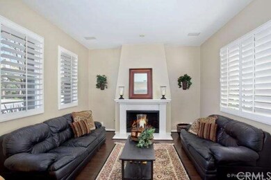 Formal living room off the Foyer wit a warm firepl