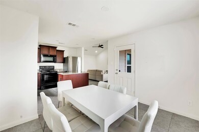 Dining area featuring light tile floors