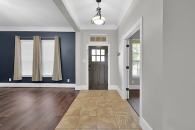 This photo showcases a bright entryway with a dark