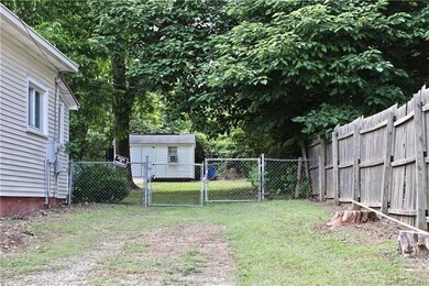 Driveway with access to rear fenced yard