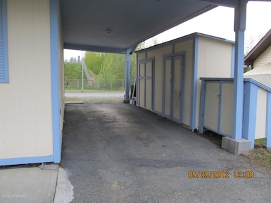 Carport w/Storage Sheds