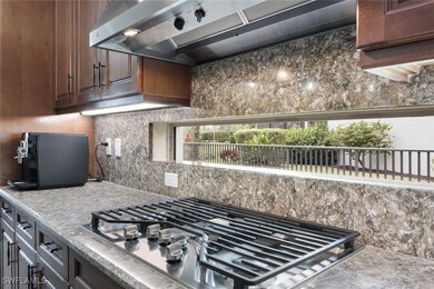 Kitchen featuring tasteful backsplash, stainless s