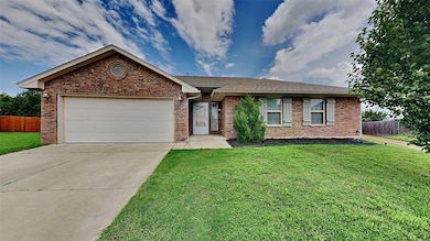 Ranch-style house featuring an attached garage, br