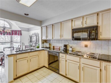 Light filled kitchen with granite countertops