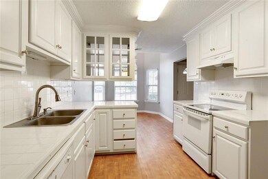 Clean and bright kitchen that opens up to breakfas