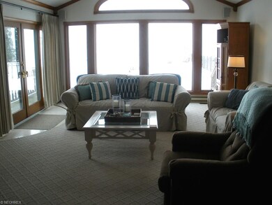 Enjoy panoramic lake views from the vaulted living