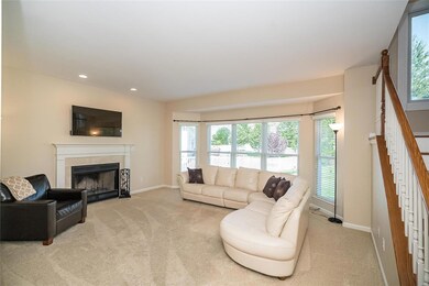 Great Room features a wood burning fireplace, bow 