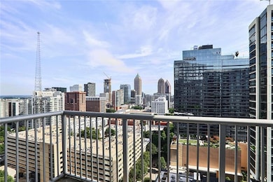 Balcony featuring a skyline view