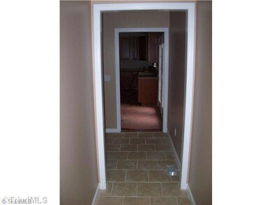 Laundry Room. Mudroom/laudrey room off side entrance with tile floors.