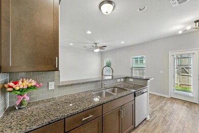 Kitchen with dishwasher, decorative backsplash, l