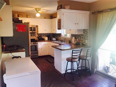 Kitchen with a breakfast bar and a large dining ar