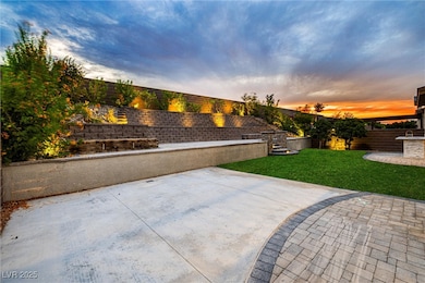 Patio terrace at dusk with a fenced backyard and a patio area
