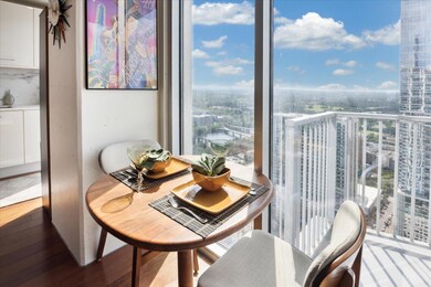 Dining space with a city view and wood finished f