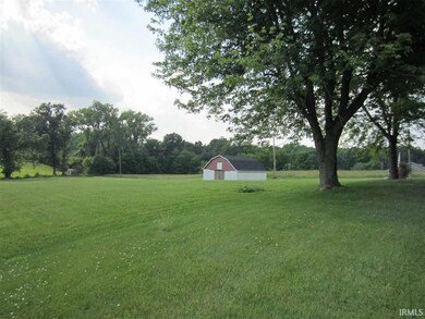 To the left of the house is the 3 stall horse barn