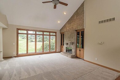 Vaulted Living Room w/Floor to Ceiling Windows