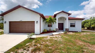 View of front of property with stucco siding, an a