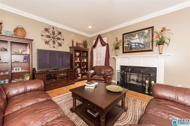 Gas fireplace anchors this room...hardwood floors,
