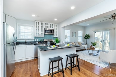Classic white kitchen with S/S appliances and gas