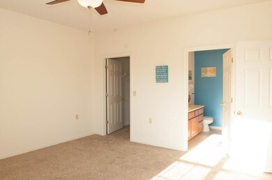 Unfurnished bedroom with ceiling fan, a spacious c