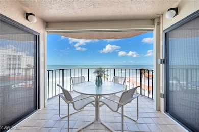 Balcony with a beach view and a water view