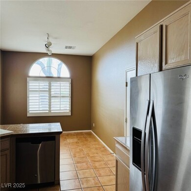 Kitchen featuring stainless steel appliances, ligh