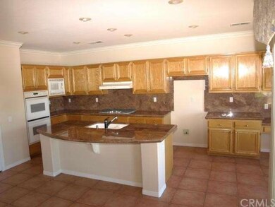 Large granite island in an expansive chef's kitche