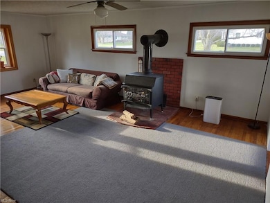 Family room with wood burner and tons of light