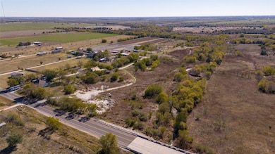 Aerial view of property's location with rural landscape