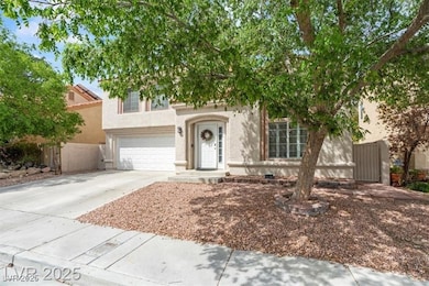 View of front of home featuring concrete driveway, a garage, and stucco siding