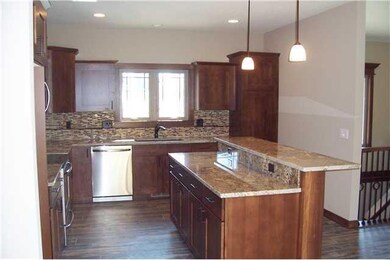 Kitchen. Tile floor. Stainless appliances.