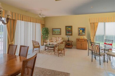 Dining space with ceiling fan and light tile patte