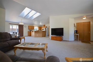 Here's a sweeping view of the entry, the principle living area with the diningroom and kitchen in the foreground. Whatever activity you are involved in, you can feel you are participating with everyone else...no locked away in a kitchen, sweating over a hot stove!