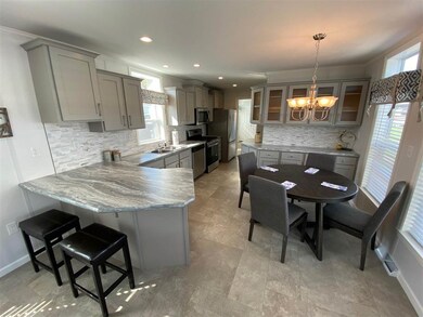Staged furniture not included as part of sale. Pic