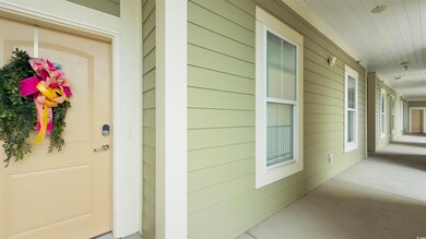 Doorway to property with covered porch