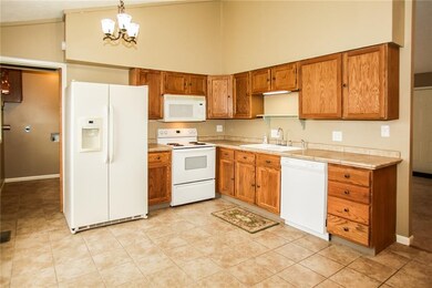 Great space in the kitchen, tiled floor and counter top.