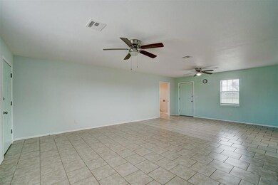 Living room and dining room with laundry room besi