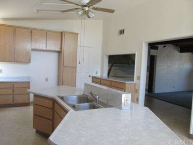VIEW OF KITCHEN ISLAND & SERVING BUFFET BAR TO DIN