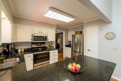 Nice kitchen with granite and brand new stainless steel appliances.