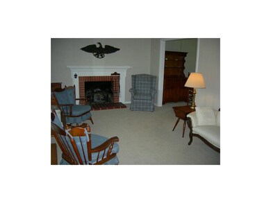 GOOD SIZE FAMILY ROOM WITH GAS BRICK FIREPLACE
