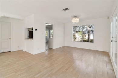 Unfurnished living room featuring light wood fini