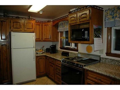 Kitchen. Window over the sink looks out onto the b