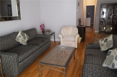 Hardwood floors, open to the dining area and kitch