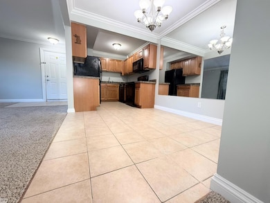 Well-designed kitchen with solid wood cabinetry, ample storage, and a full appliance set.    •   Neutral countertops and clean sightlines give buyers room to personalize while still move-in ready